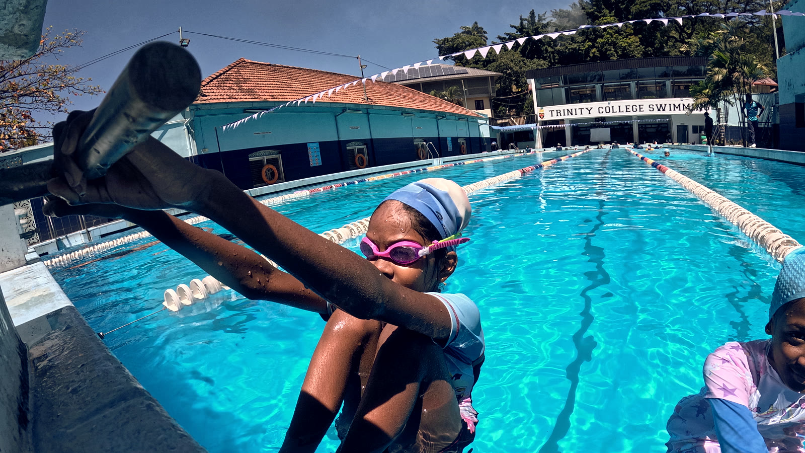 Young swimmer at pool edge